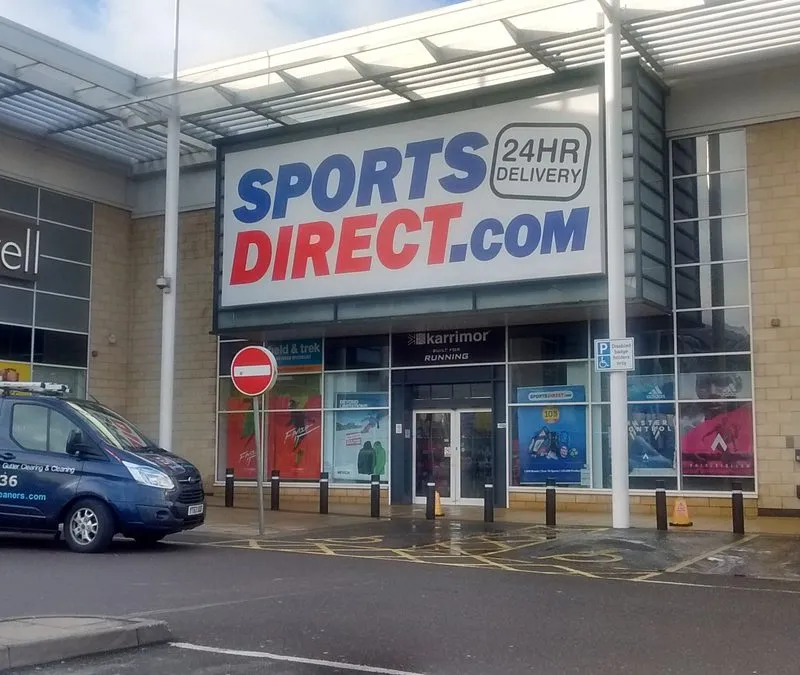 Commercial window cleaning at Sports Direct in Bracknell with the Brilliant Window Cleaners van outside