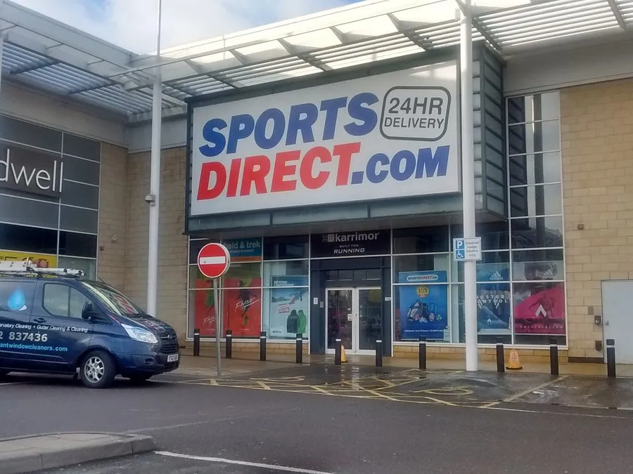 Commercial window cleaning at Sports Direct in Bracknell with the Brilliant Window Cleaners van outside