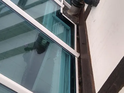 The same conservatory gutter clear and flowing after gutter cleaning