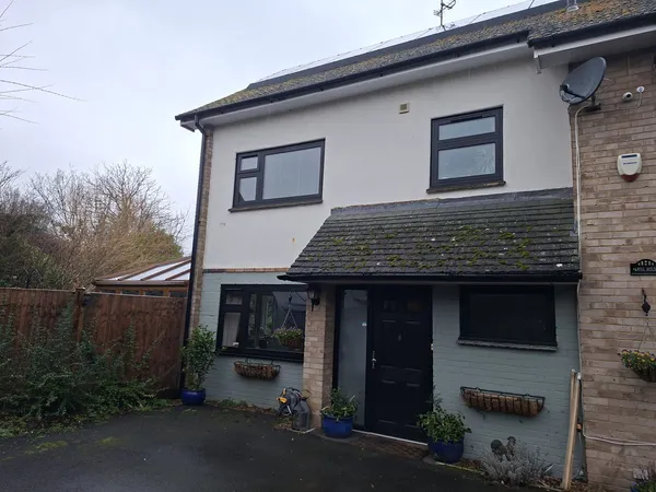 Roof cleaning and moss removal on a detached house in Guildford
