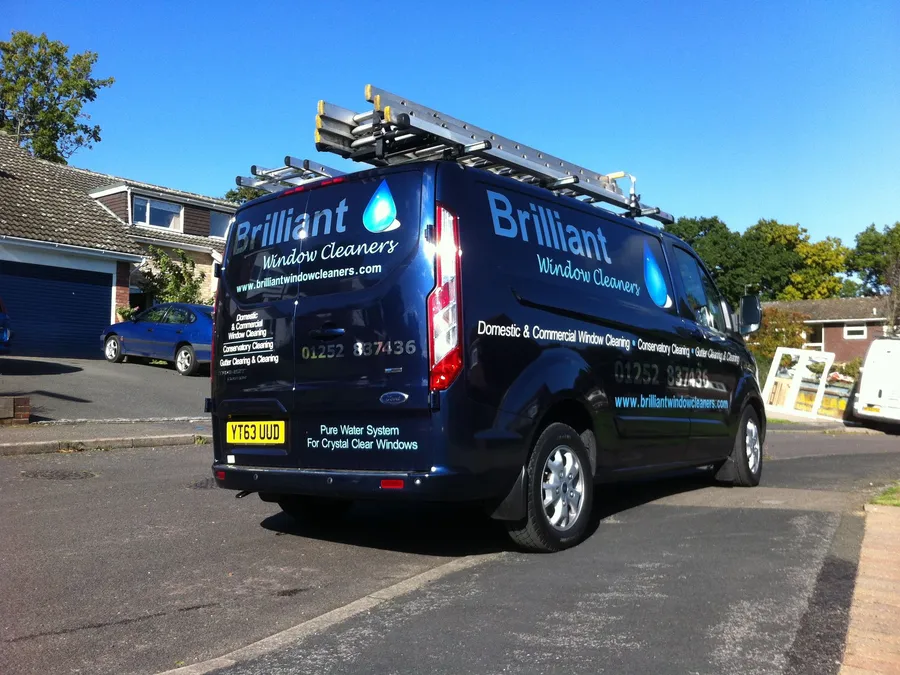 The Brilliant Window Cleaners navy Transit with ladders and the pure water system on board