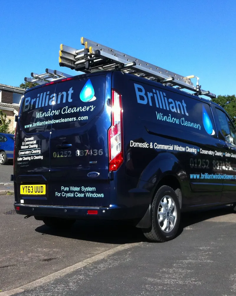 The Brilliant Window Cleaners navy Transit with ladders and the pure water system on board